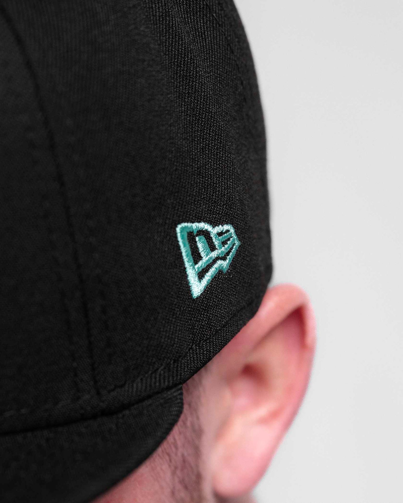 Turquoise Shield NE Snapback Hat