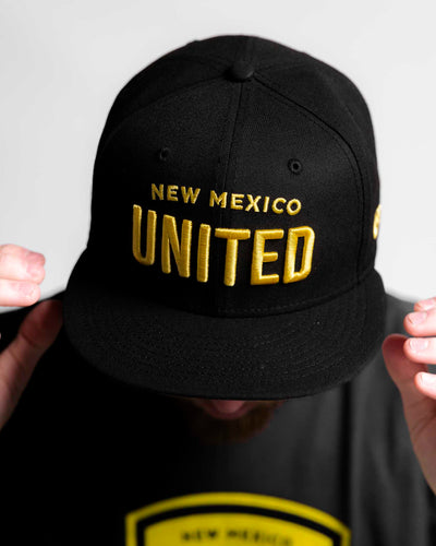 United Wordmark NE Snapback Hat