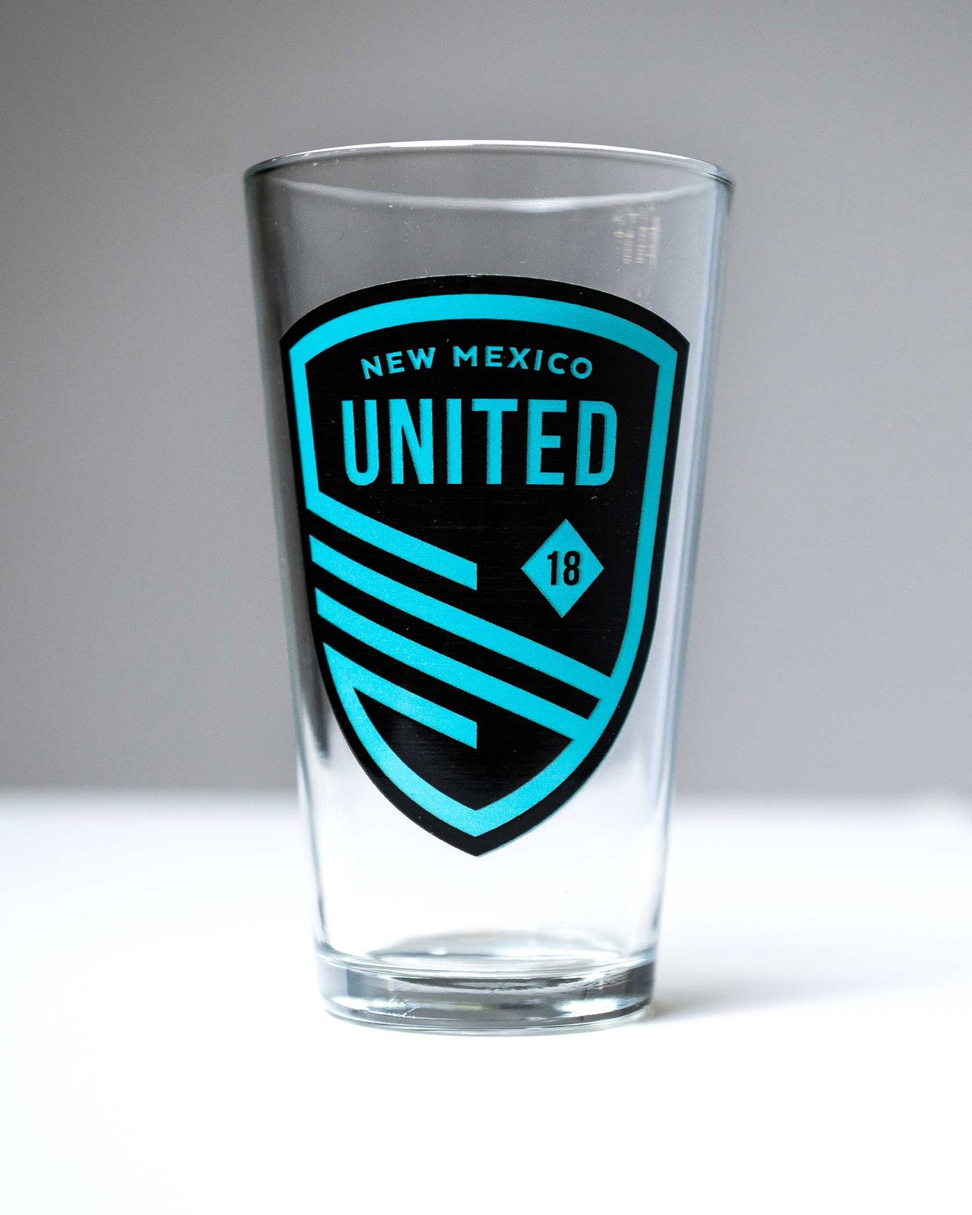 Turquoise Shield Pint Glass